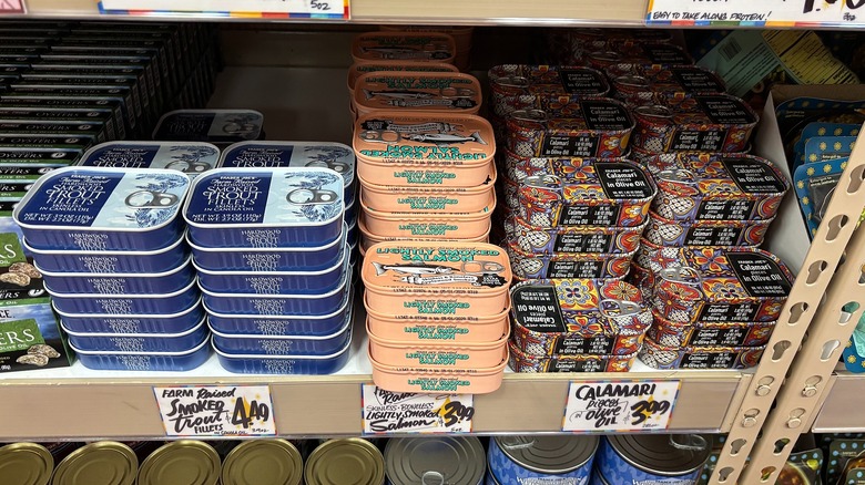 Tins of fish on shelf in Trader Joe's