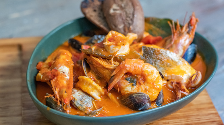Italian seafood soup in blue bowl