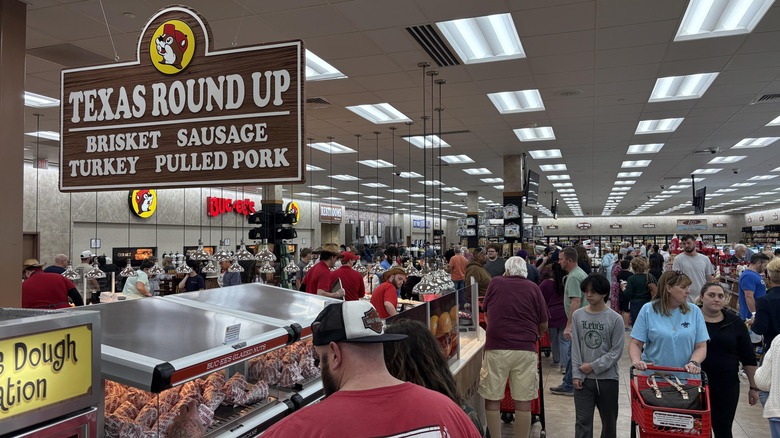 guests inside Buc-ee's near bbq counter