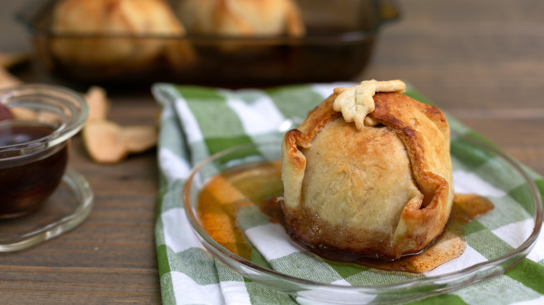 An apple dumpling on a glass plate