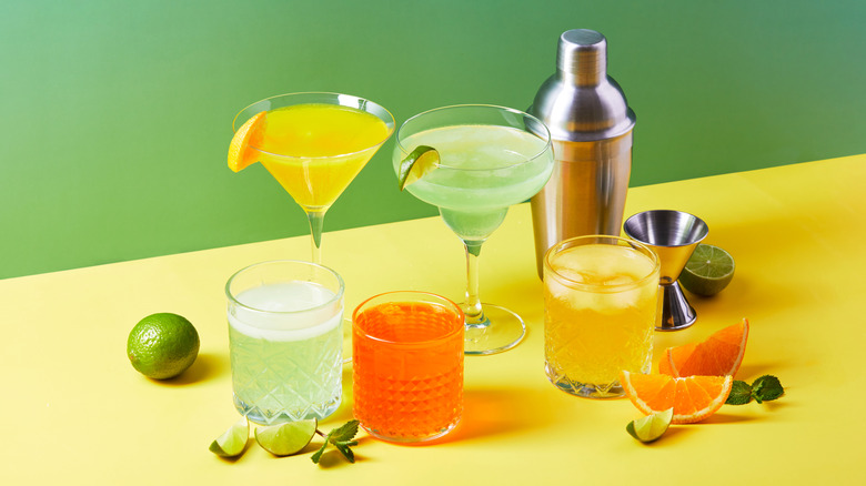Assorted cocktails on yellow table