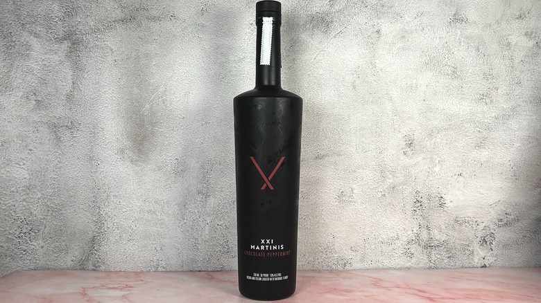 Bottle of XXI Chocolate Peppermint Martini on grey wall background