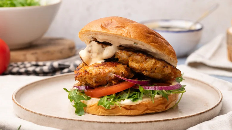 Stacked copycat Nando's Peri Peri Chicken Sandwich on a plate