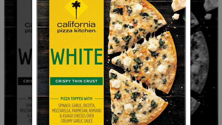 Closeup of the box of a California Pizza Kitchen white pizza with thin crust