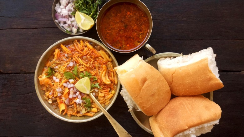 Misal pav served with onion, lemon, and broth