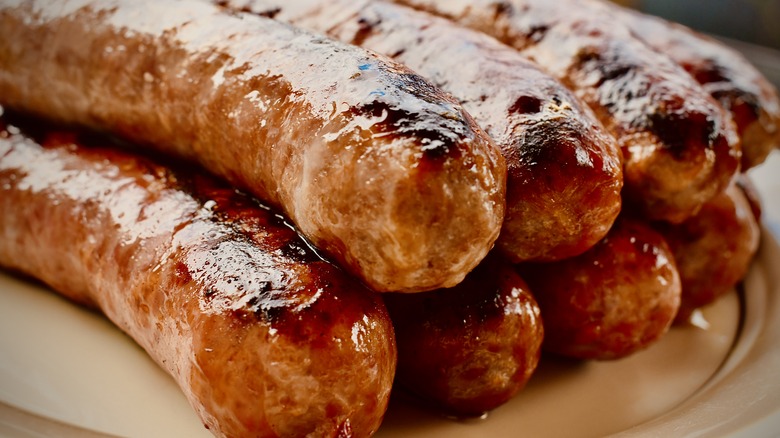 Grilled Italian sausages on white plate
