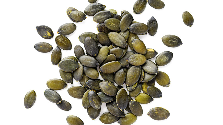Pumpkin seeds on white background