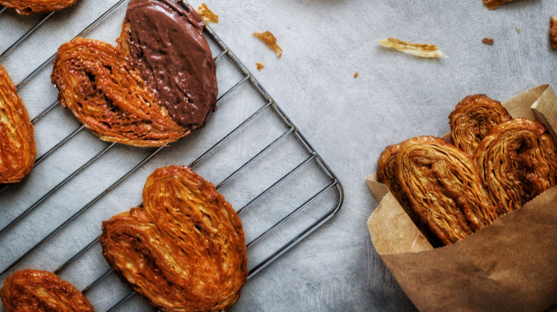 Freshly baked schweineohren, one dipped in chocolate