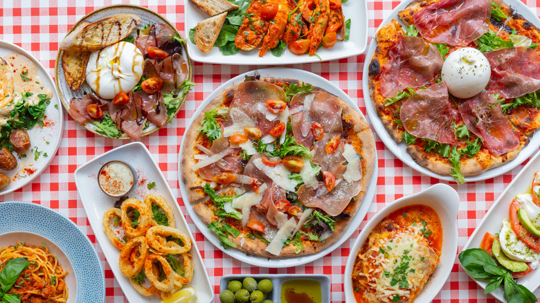 Table full of large servings of Italian dishes