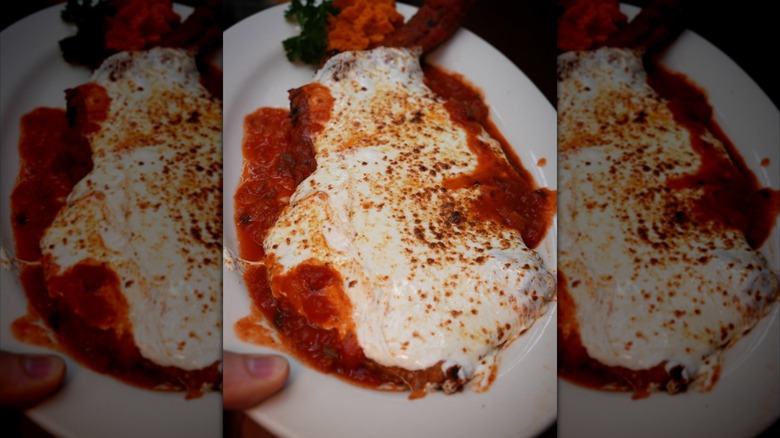 Veal chop on a plate with cheese
