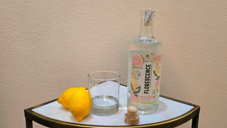 Fluorescence vodka bottle, glass, and lemons