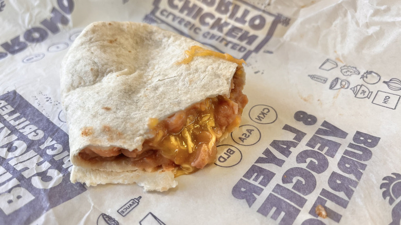 Close-up of bean and cheese burrito with green sauce