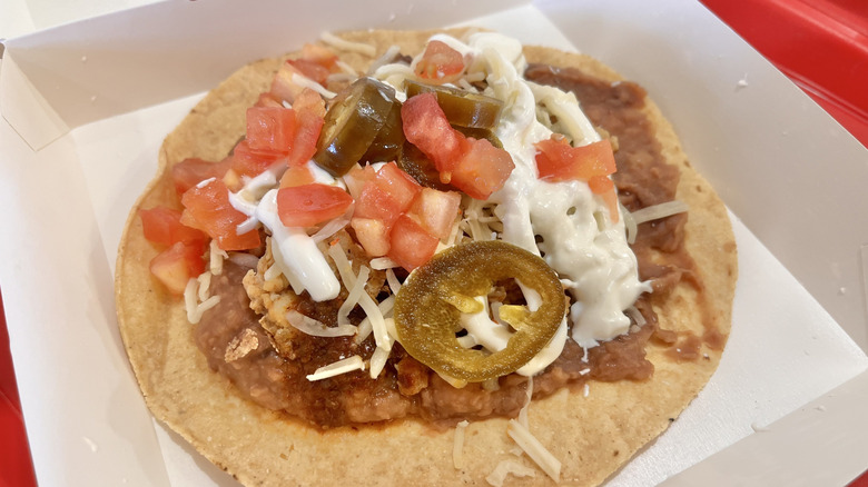 Side view of a tostada with toppings