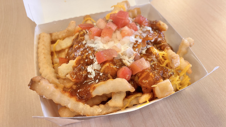 Side view of chili cheddar fries