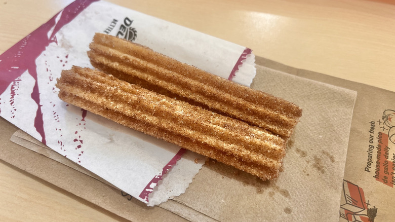 Cinnamon churros on a napkin