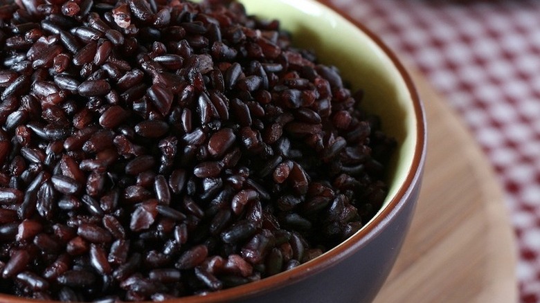 Close up of bowl of black rice pudding