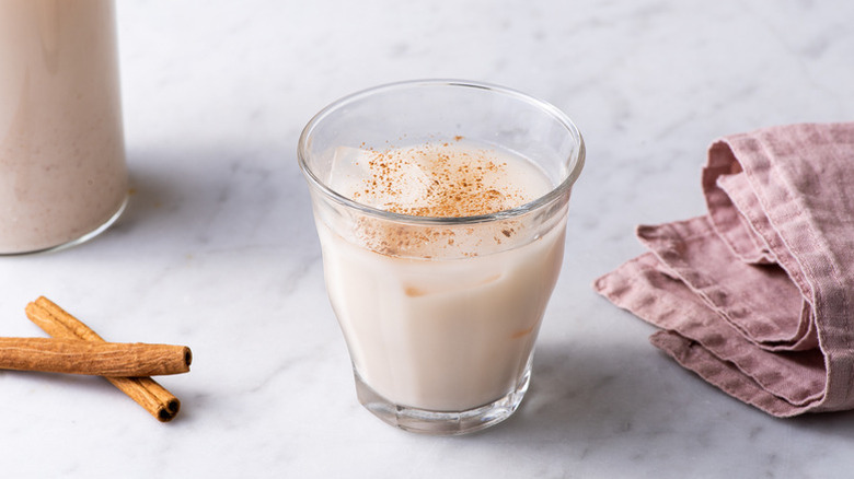 Glass of Mexican horchata, dusted with cinnamon