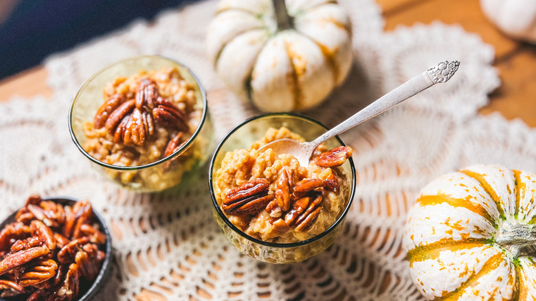 Pumpkin pecan rice pudding in two serving glasses