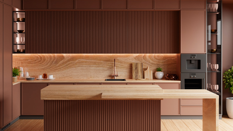 A modern kitchen painted with two different shades of brown for the cabinets.