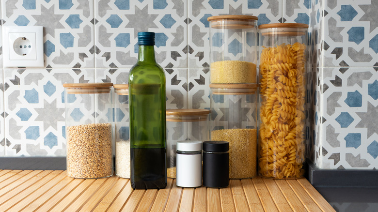 Glass containers with various ingredients inside.