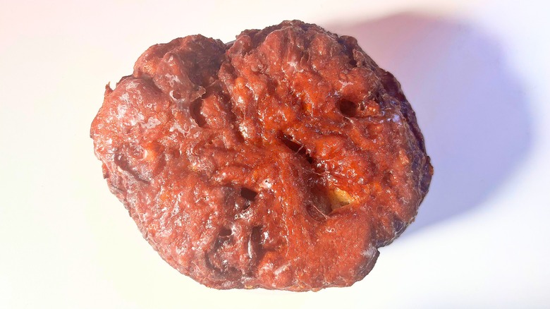 Voodoo Doughnut Apple Fritter on white table
