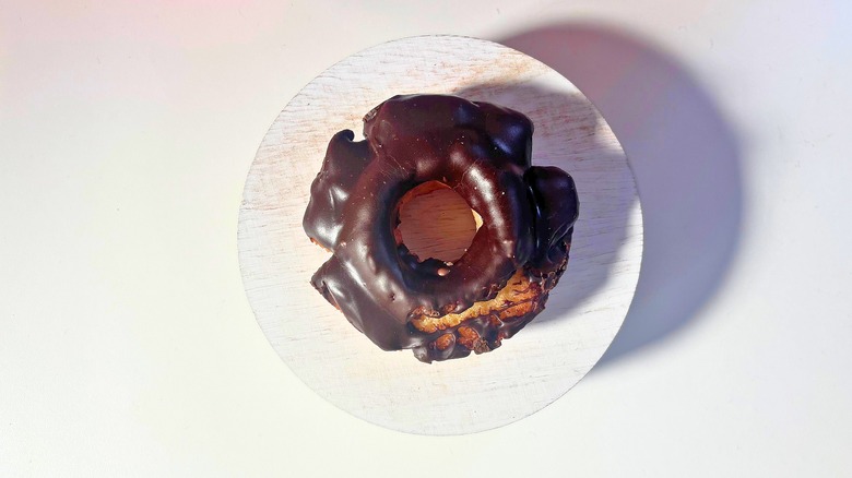 Voodoo Doughnut Chocolate Old Fashioned donut on white table