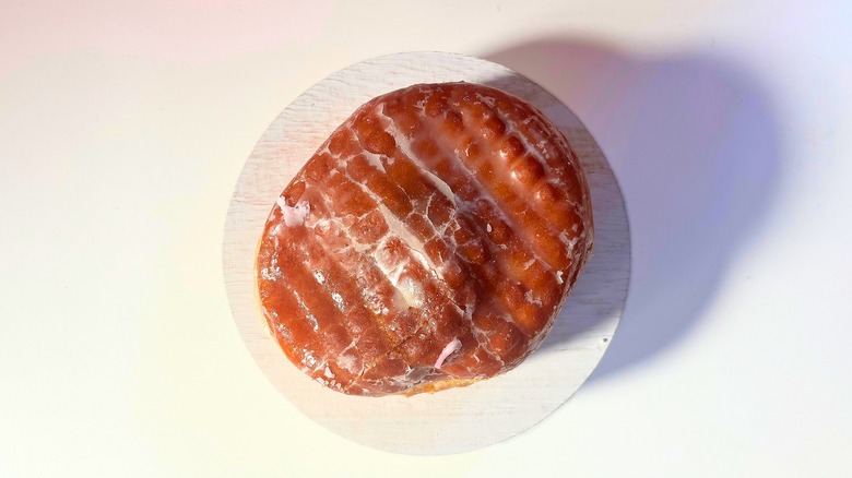 Voodoo Doughnut Raspberry Romeo donut on white table