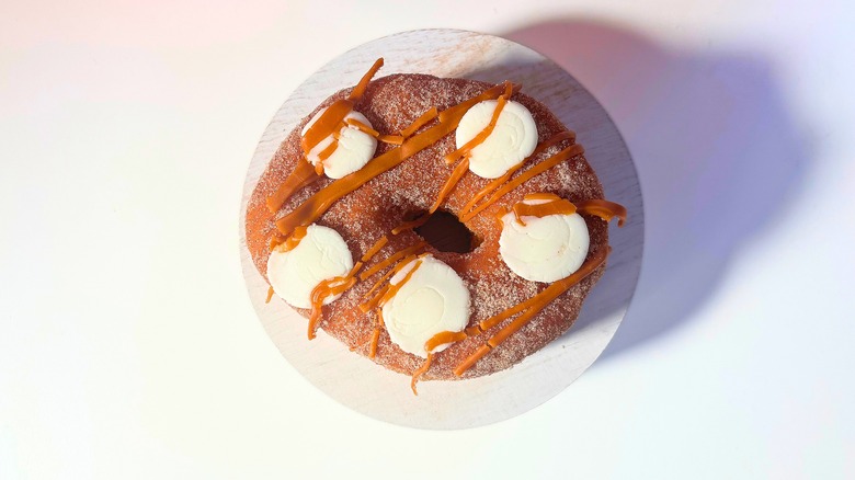 Voodoo Doughnut Churro Cheesecake donut on white table