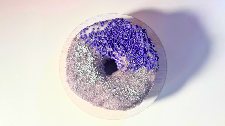 Voodoo Doughnut Grape Ape donut on white table