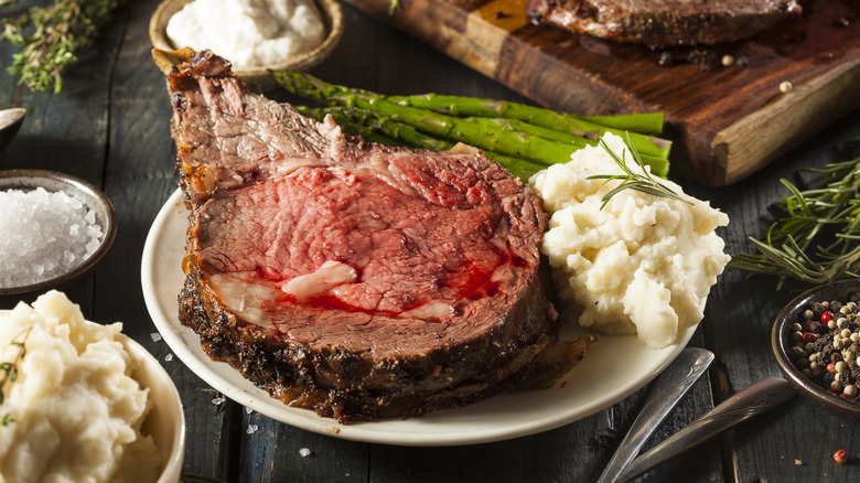 Prime rib dinner with asparagus and mashed potatoes