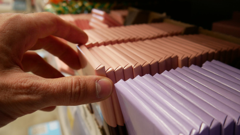 person shopping for candy bar
