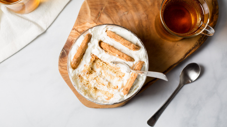yogurt with cookies on table
