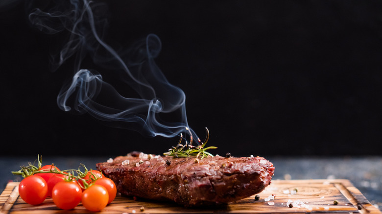 Steak with rosemary and tomatoes