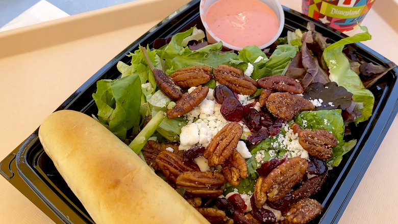 Cranberry-pecan salad from Jolly Holiday on a black tray