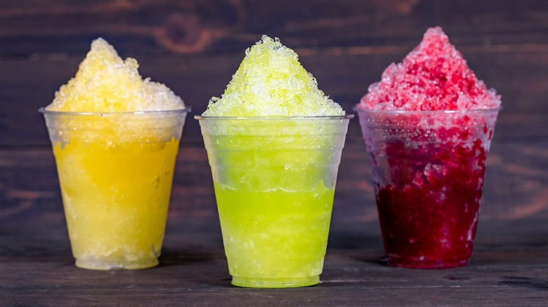 Three Sno-Ball cups in different flavors at Disneyland