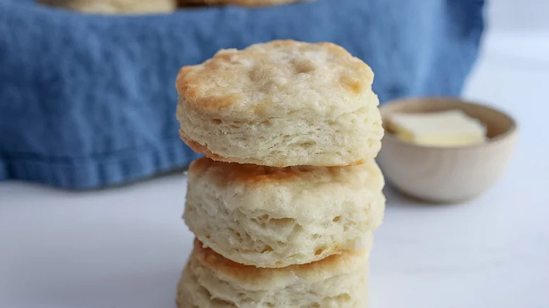 Fluffy Southern Biscuits stacked on white surface