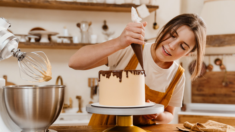 Person making chocolate cake kitchen