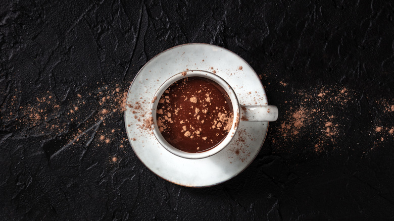 Top down shot of hot chocolate with chocolate powder