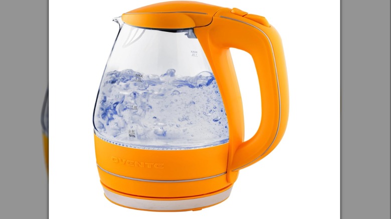 An orange OVENTE kettle