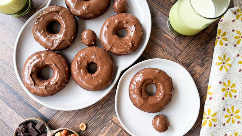 Nutella-glazed donuts on serving plates