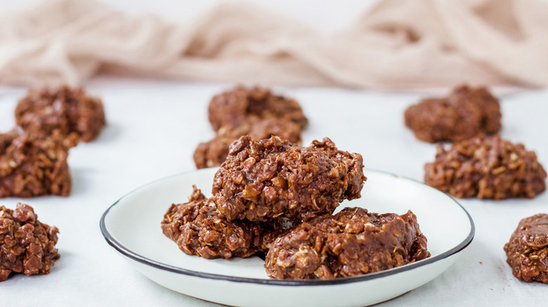 Three no-bake Nutella oat cookies on a white plate