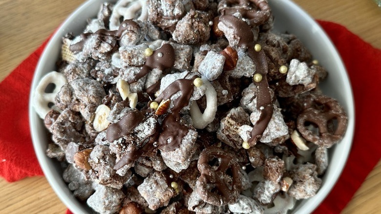 White bowl of chocolatey Chex cereal muddy buddies