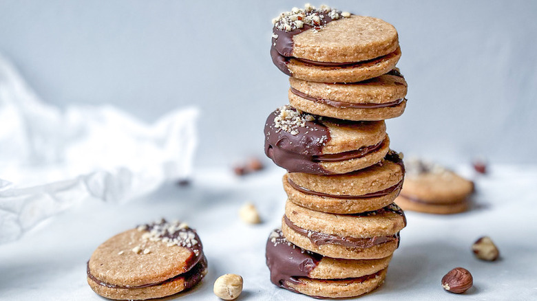 Stack of chocolate-dipped hazelnut sandwich cookies