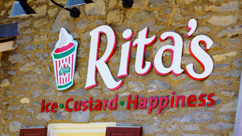 Rita's Italian Ice sign against stone building