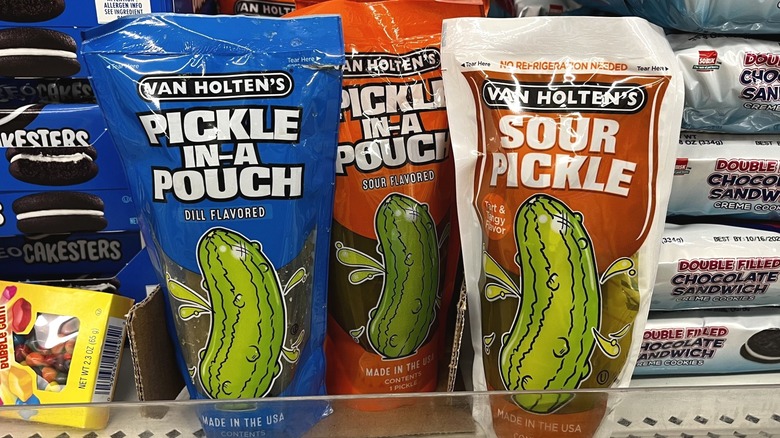 Single pickles packaged in pouches displayed upright
