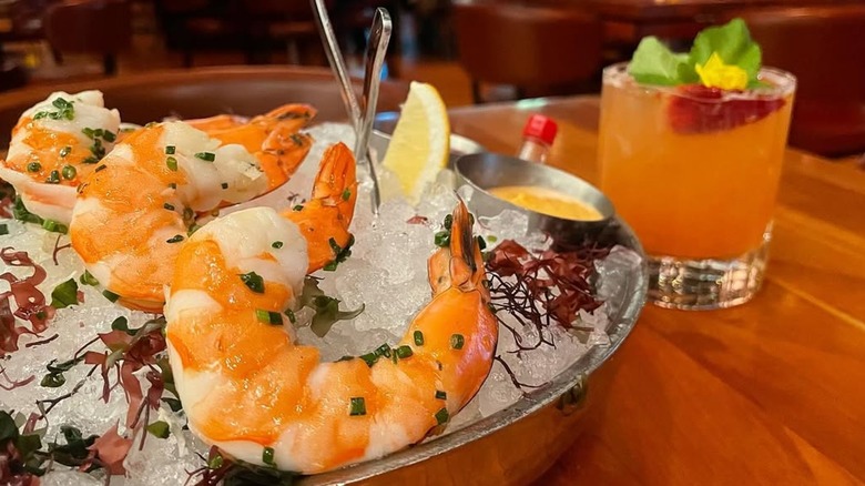 Shrimp cocktail and cocktail at StripSteak