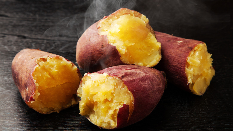 Roasted, halved sweet potatoes with steam rising from them