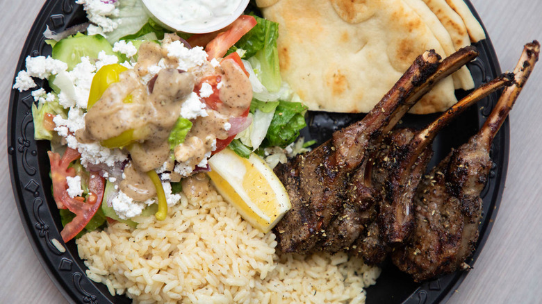Lamb chops with rice and Greek salad