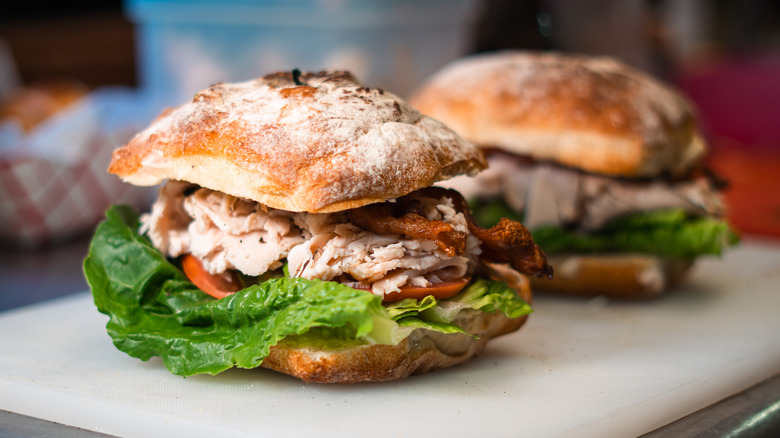 Ciabatta sandwich with chicken, lettuce, and tomato