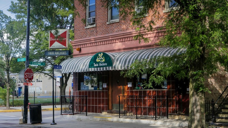 Exterior of the Twin Anchors with door and green awning